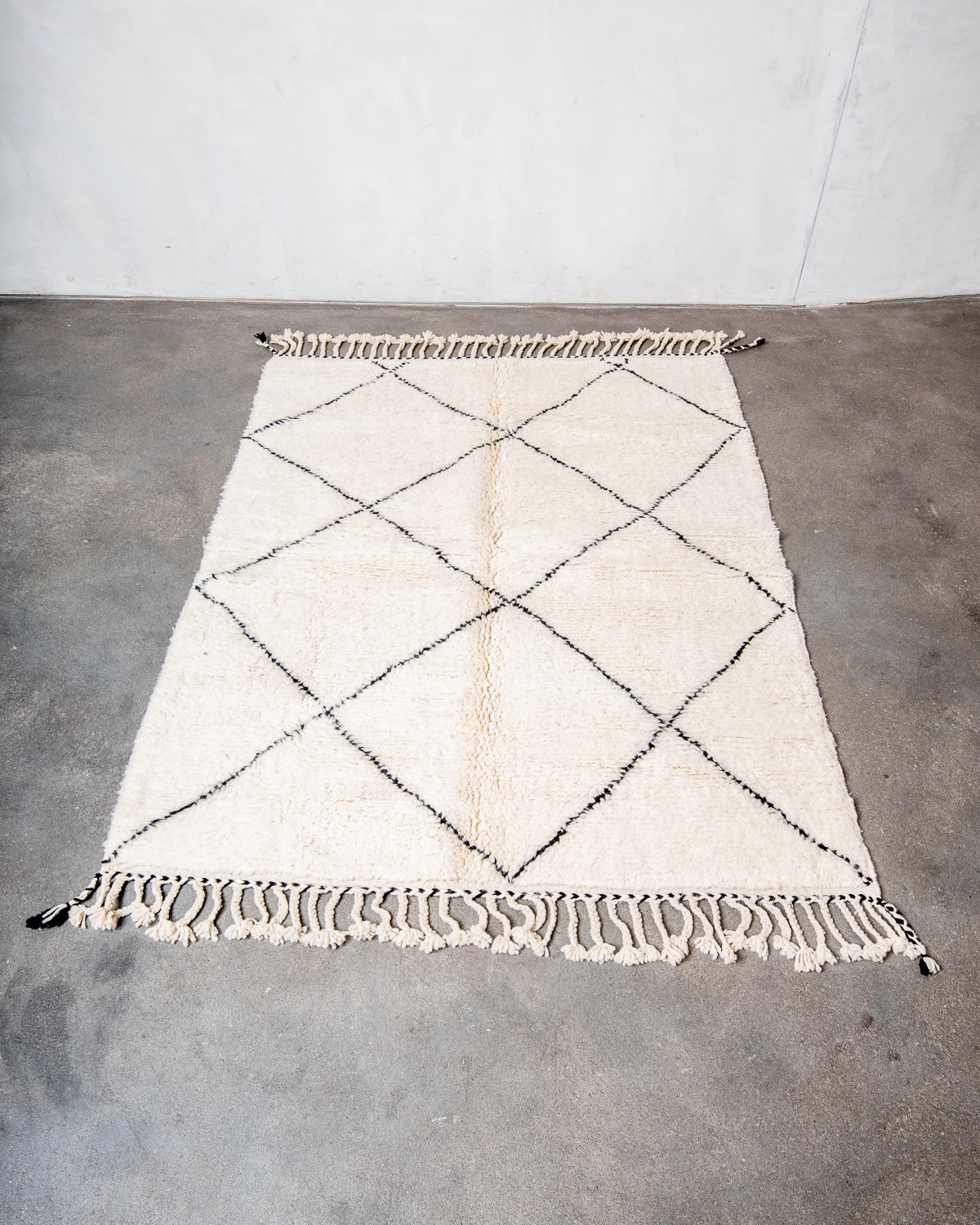 Modern, designer, handcrafted Berber rug from Morocco. Beniourain carpet with minimalist design, natural wool pile and a fluffy texture.